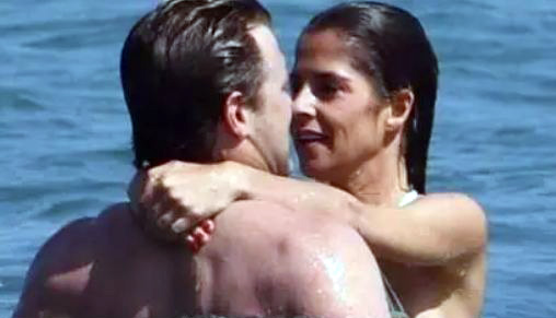 Photo of Kelly Monaco and Billy Milano in a beach.