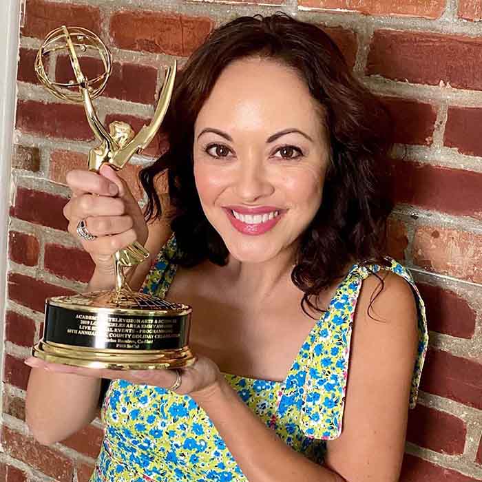 Photo of Marisa Ramirez holding LA Area Emmy.